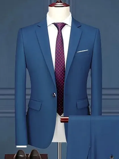 A simple and elegant two-piece suit in a bright blue. This is a great staple for any man's wardrobe, perfect for a variety of occasions.