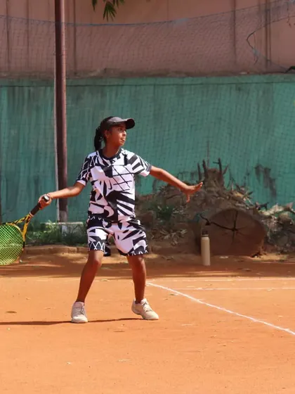 A young player making contact with the ball out in front. This is a key element for generating power and control.