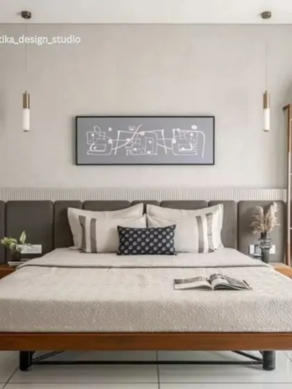 A beautiful example of a modern neutral bedroom. The low, platform-style bed with a wooden frame gives it a grounded, calm feeling. I used two simple pendant lights instead of table lamps to keep the nightstands clear and maintain a minimalist aesthetic.