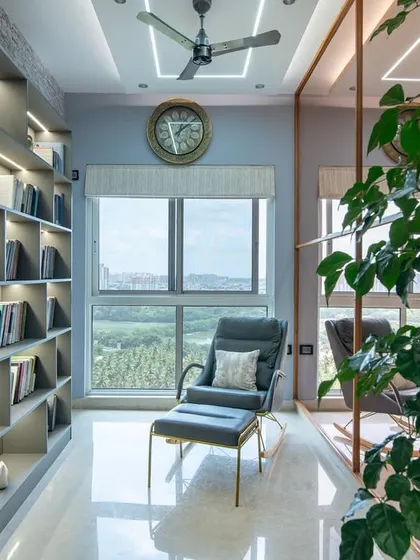 This reading corner at SNN Clermont transforms literature into luxury. A built-in bookcase with integrated lighting and a comfortable rocking chair create the perfect spot to unwind with a book.