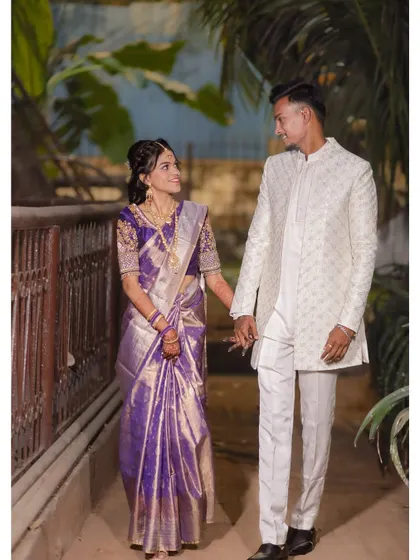 A candid shot of the couple walking hand-in-hand and sharing a look. This captures a natural, in-between moment that feels authentic and full of love.