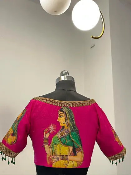 Another angle of the hand-painted blouse, highlighting the craftsmanship and unique design.