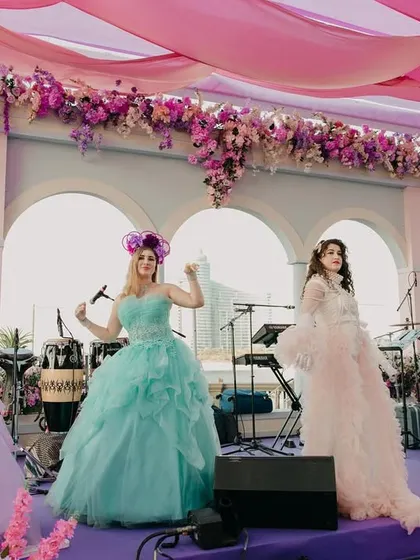 Adding a touch of grace to this beautiful Bridgerton-themed Mehendi ceremony with performers in ethereal gowns, creating a scene of pure elegance.