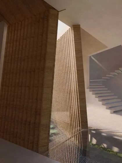 This view of the Cumin Residence showcases the interplay of light, shadow, and texture. A slatted wooden wall provides privacy while allowing glimpses of the water body and staircase beyond, creating layers within the space.