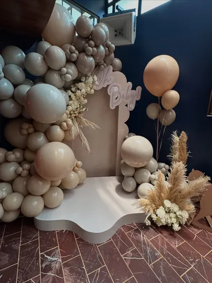 A wider shot of the photo booth, showing how the balloon installation creates a beautiful and inviting space for pictures.