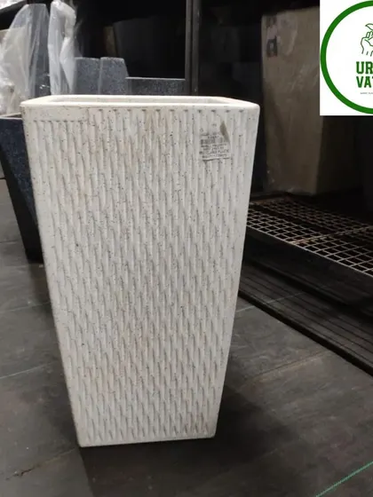 A white, textured, square fiber pot.