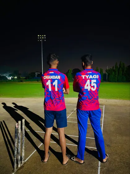 Two powerhouses, one battlefield, under the lights. Our players ready for a night match.