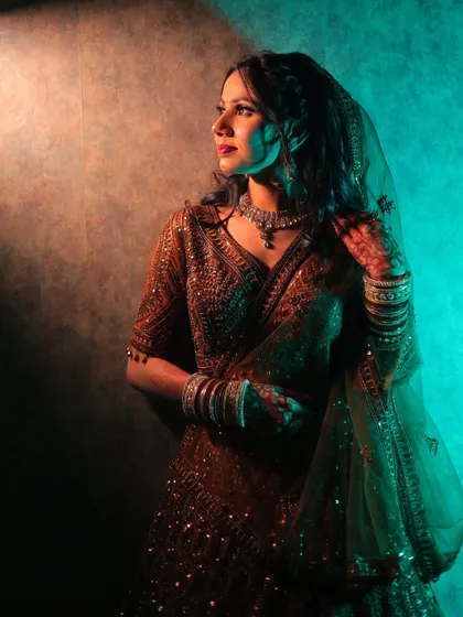 Another portrait from the same creative lighting setup, showing a different pose.