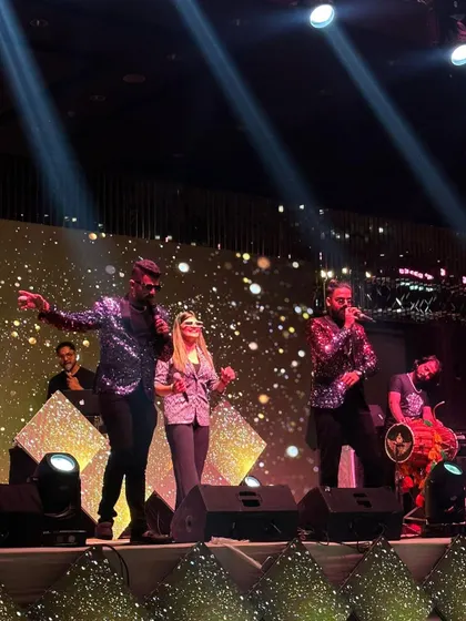 The full band on a grand stage, ready to deliver a power-packed performance. This is the scale of entertainment we bring to make your corporate event a superhit.