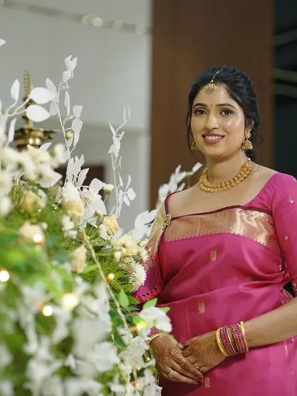A beautiful, serene portrait of the bride. Her makeup is soft and romantic, perfect for the occasion.