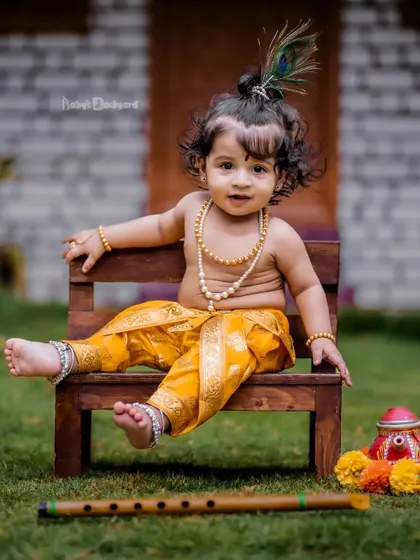 Celebrating the innocence and mischief of our little Krishna, complete with his flute and pot of butter.