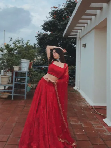 Another artistic pose in the red lehenga.