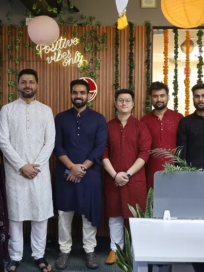 A smaller group of colleagues posing for a picture. Creating spaces that encourage interaction and photo opportunities is a key part of my event design.