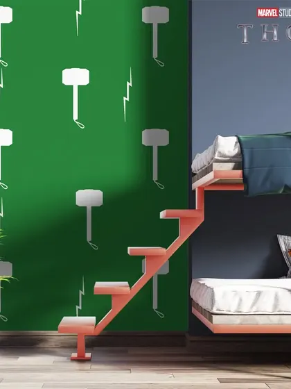 A Thor-themed bunk bed room featuring a pattern of his hammer, Mjolnir, and lightning bolts on a green accent wall.