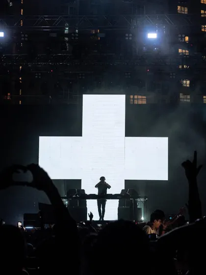 The iconic silhouette of Martin Garrix against his cross logo, a powerful and instantly recognizable image.