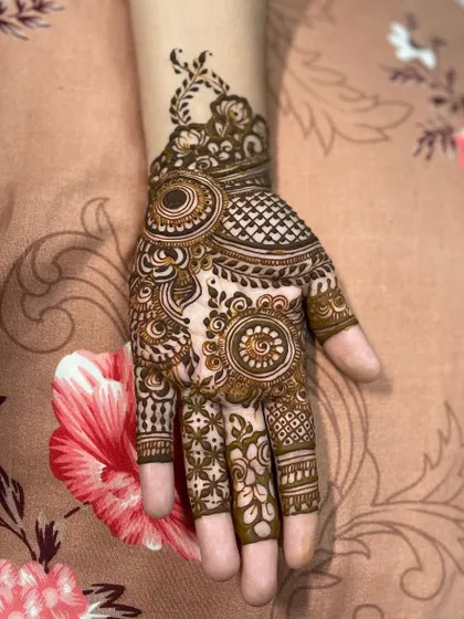 A special treat for a friend. This design features a mix of mandalas and paisleys, with delicate work extending up the wrist.