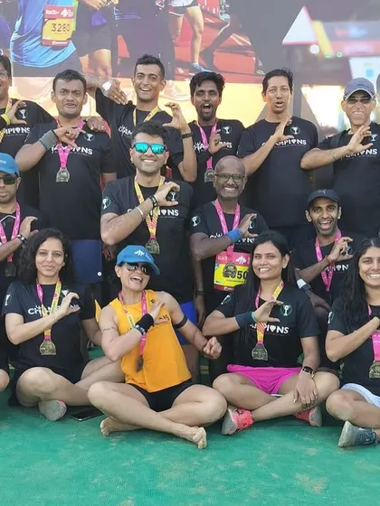 A duplicate of media 43 and 45, the team making our signature 'C' for Champions sign. A symbol of our unity.