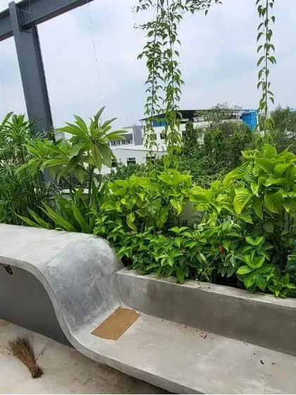 This is a duplicate of image 27. Another angle of the F Gear terrace garden, showing the depth and variety of plants used. We selected species that thrive in Bengaluru's climate, ensuring the space remains green and beautiful with our ongoing maintenance services.