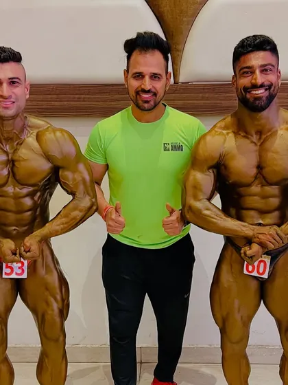 Team. Standing with two of my champion athletes, both in peak condition.