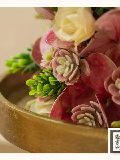A detailed view of the textures within a floral arrangement, from the soft petals of the succulents to the rich color of the hydrangeas.