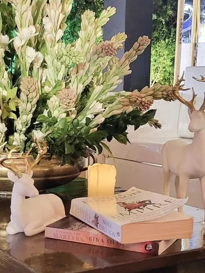 Another angle of the elegant tabletop decor, showing how small, curated props can enhance the overall theme.
