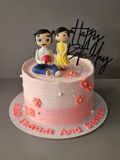 The bond between a grandfather and granddaughter. This vanilla blueberry cake features a sweet figurine of them together.