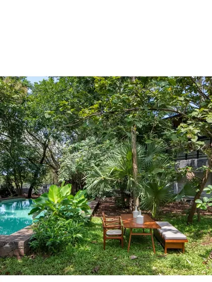An alfresco dining spot at the 'Villa in a Grove'. Life is lived out of doors here, amidst the cacophony of birds and the rustle of leaves.