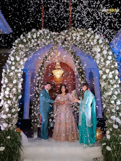A family member joins the couple on stage, highlighting the importance of family in these milestone celebrations. We ensure to capture these inclusive moments.
