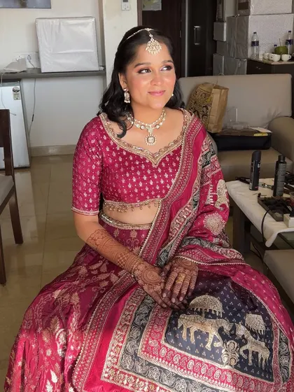 Enhancing natural beauty with a soft touch for the bride's sister. The makeup is fresh and youthful, perfect for a bridesmaid.