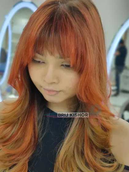 Another angle of this imaginative Y2K color. The blend of orange and blonde is seamless and eye-catching.