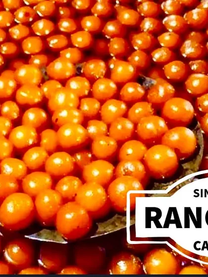 A large cauldron filled with freshly made Gulab Jamuns, soaking in sweet syrup. This shows our capacity to handle large-scale catering for weddings and festivals without compromising on quality.