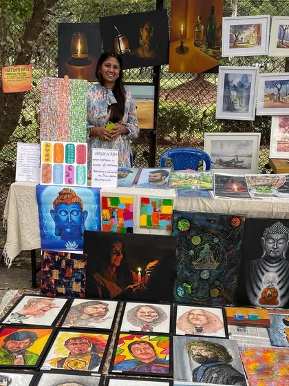 My wife helping manage the stall at Chitra Santhe.