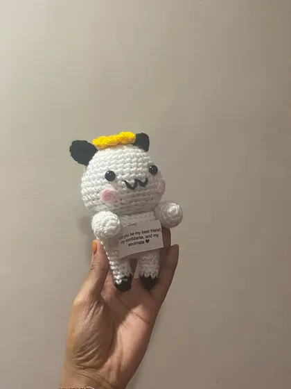 A close-up of the message doll. The note reads, "Will you be my best friend, my confidante, and my soulmate?"