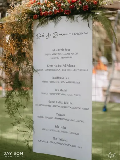A personalized bar menu for the "Rose & Romance" garden bar, with a custom cocktail list featuring creative, themed names.