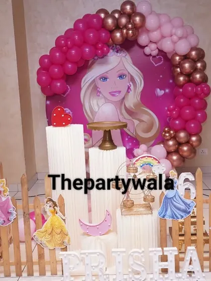 A full view of the Barbie theme party, complete with a welcome sign. The setup includes multiple character cutouts and a beautiful pink and rose gold color scheme that's perfect for photos.