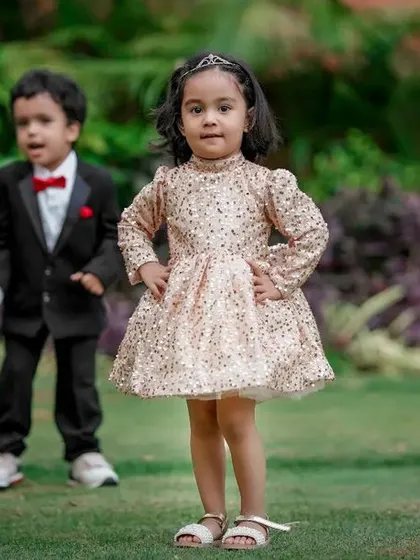 Two little bundles of joy, dressed up and ready for their photoshoot. Sibling photos are always double the fun.