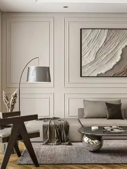 A serene living room with a neutral color palette and textured wall panels. The design focuses on clean lines and subtle details, creating a calm and sophisticated environment that feels both modern and timeless.