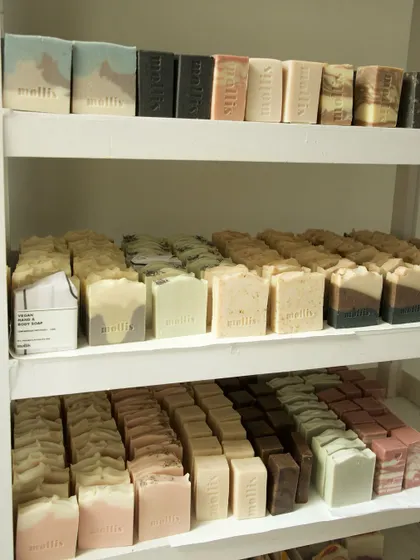 The full view of my curing station, with three shelves loaded with freshly made soaps.