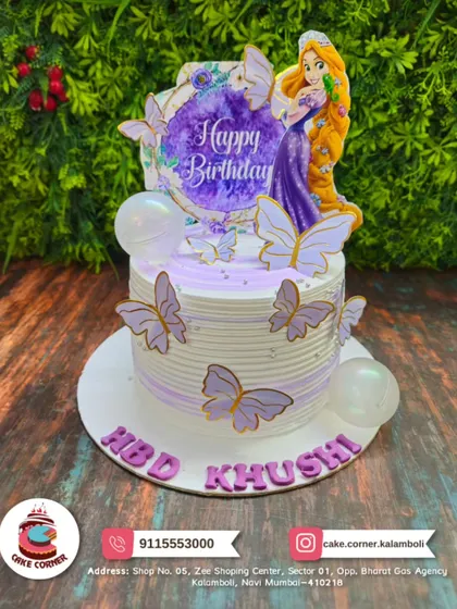 An enchanting princess cake with butterflies and a Rapunzel topper. The purple and white design is perfect for a fairytale-themed birthday.