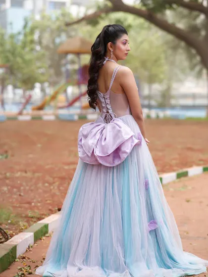 A view of the back of the gown and the hairstyle.