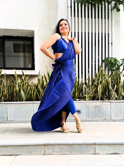 The drape allows for movement and flair, making it as practical as it is stylish.