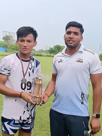 A player with his 'Guru ji'. The bond between coach and student is built on respect, trust, and shared goals.