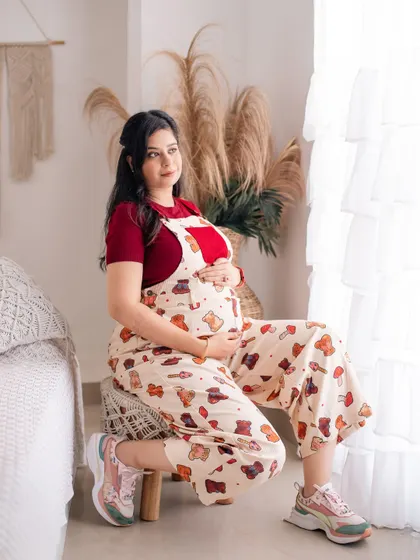 A quiet, contemplative moment in our boho-chic studio setup, showing a different, more relaxed side of maternity portraits.