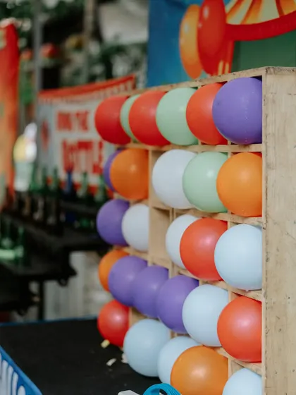 A balloon-popping game stall, one of the many fun activities we can arrange to entertain guests.
