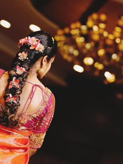 A view of the back of the engagement blouse, showing the delicate embroidery and the beautiful hairstyle it allows.