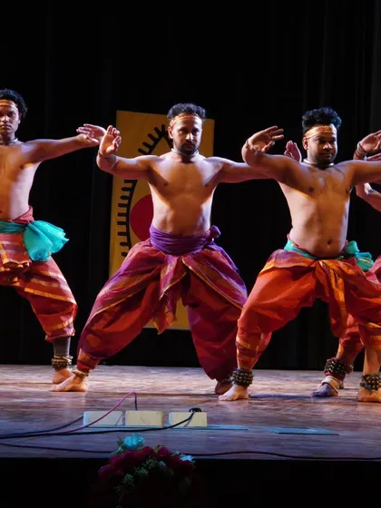 A synchronized group pose by four of my male dancers. This demonstrates the unity and collective strength of the troupe in executing powerful Chhau movements.