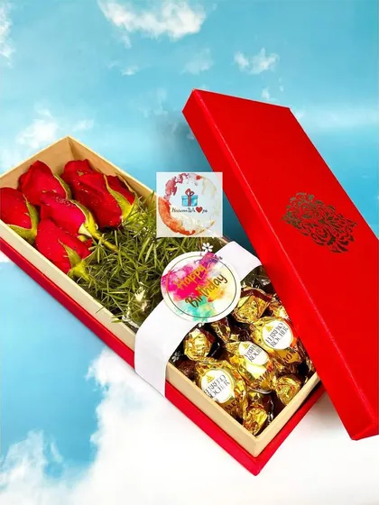 The lid is off our roses and chocolate box, revealing the full arrangement of treats inside.