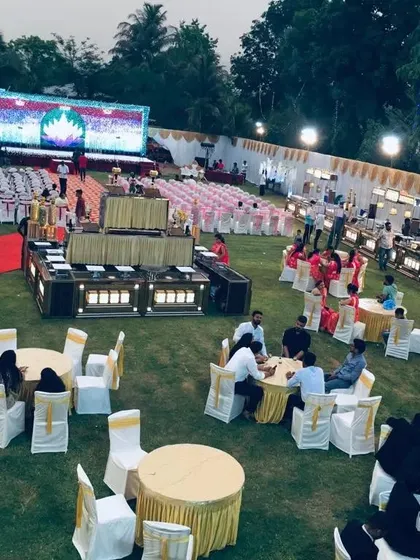 If you're dreaming of a large-scale destination wedding, I can make it happen. This is an aerial view of a massive outdoor event setup at Shrusti Farm House & Resort in Panvel, perfect for a guest list of 1000 or more.
