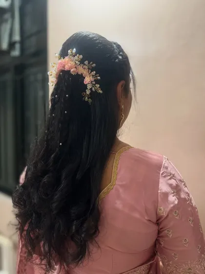 A side view of the crimped and braided hairstyle. This look is perfect for someone who wants a modern yet intricate hairstyle for a special event.