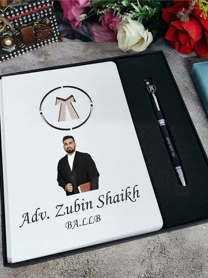 For the advocate in your life, this personalized diary and pen combo is a perfect gift. The diary features the lawyer's emblem and can be customized with their name, photo, and title.